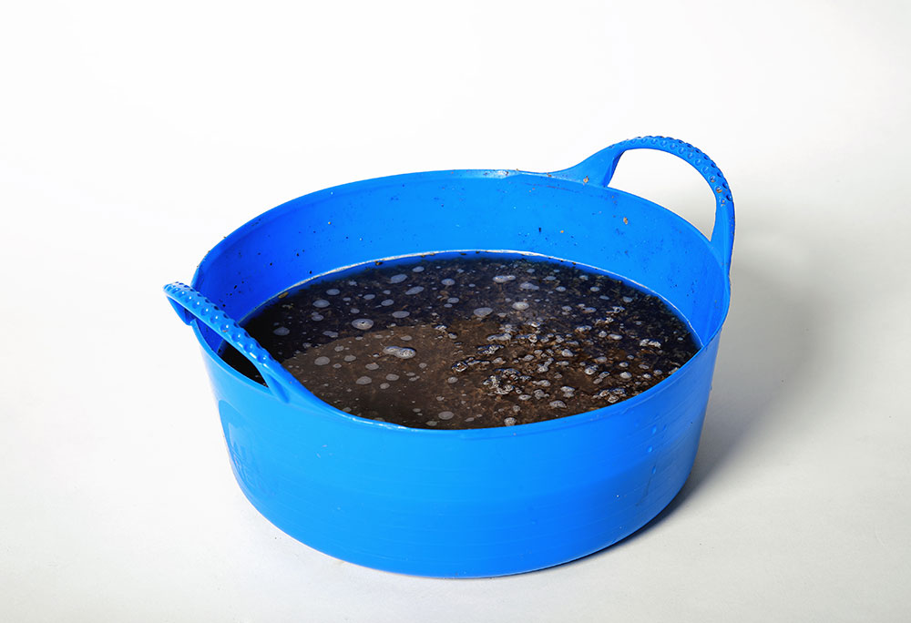 How To Help Overcome Dehydration In Horses A bucket of horse feed used to help overcome dehydration in horses.