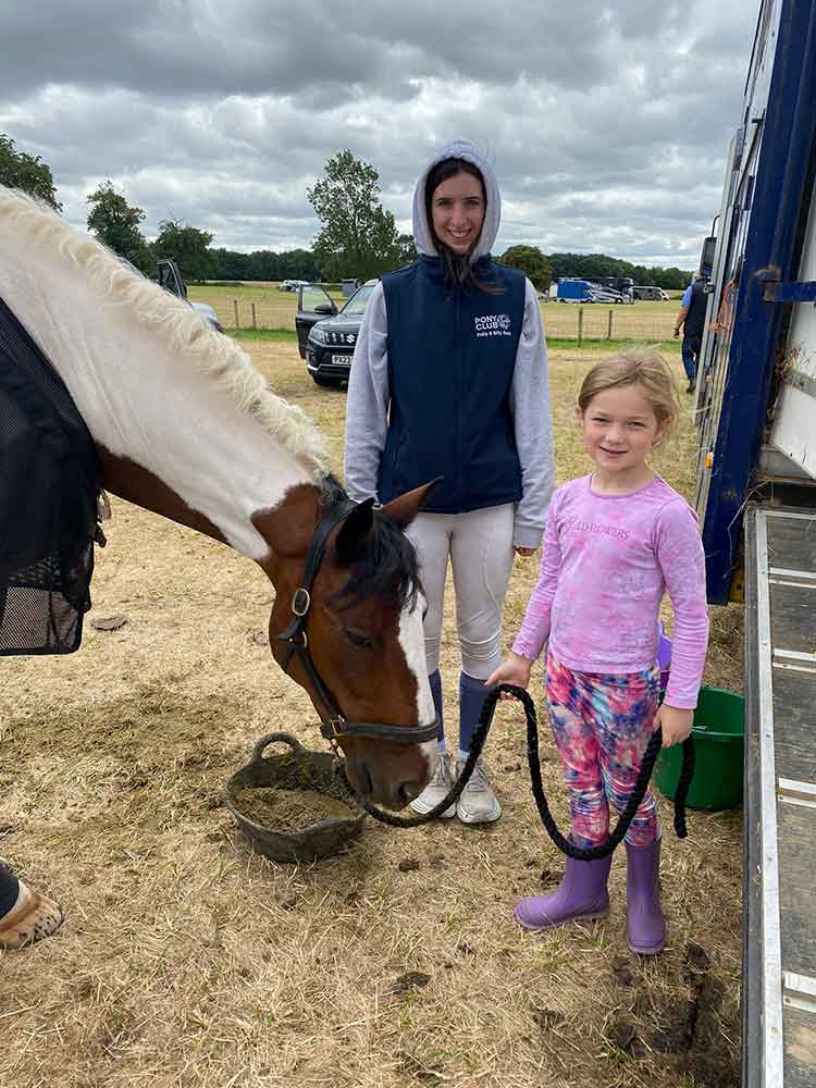 horse-stood-with-two-people